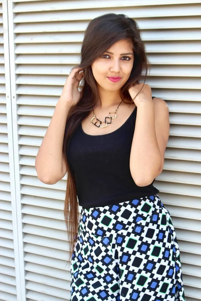 Real customer styling featuring circular looped pendant necklace