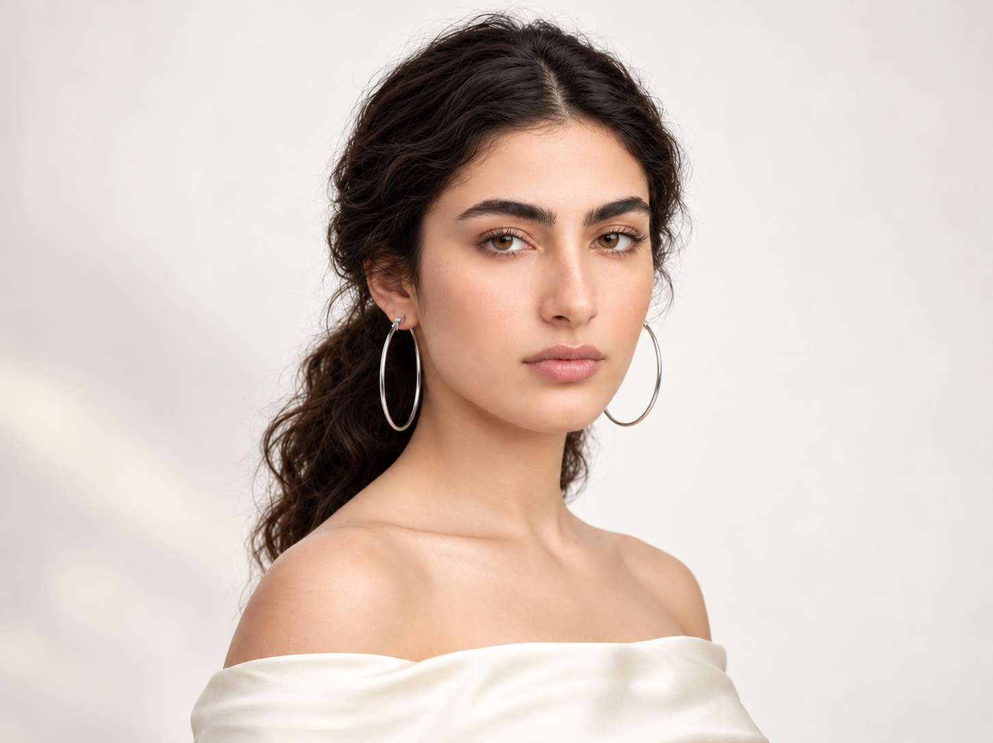 The Swag Squad Monthly Muse - Minimalist satin portrait with silver hoop earrings